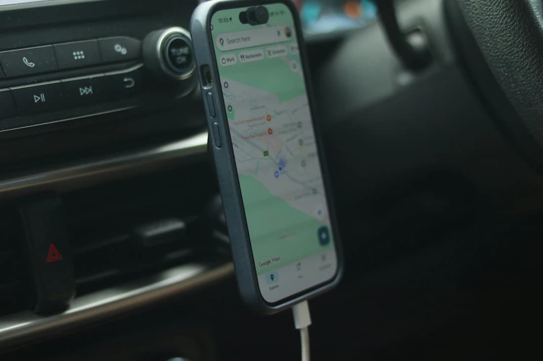 Google Maps navigation shown on a phone mounted inside a car